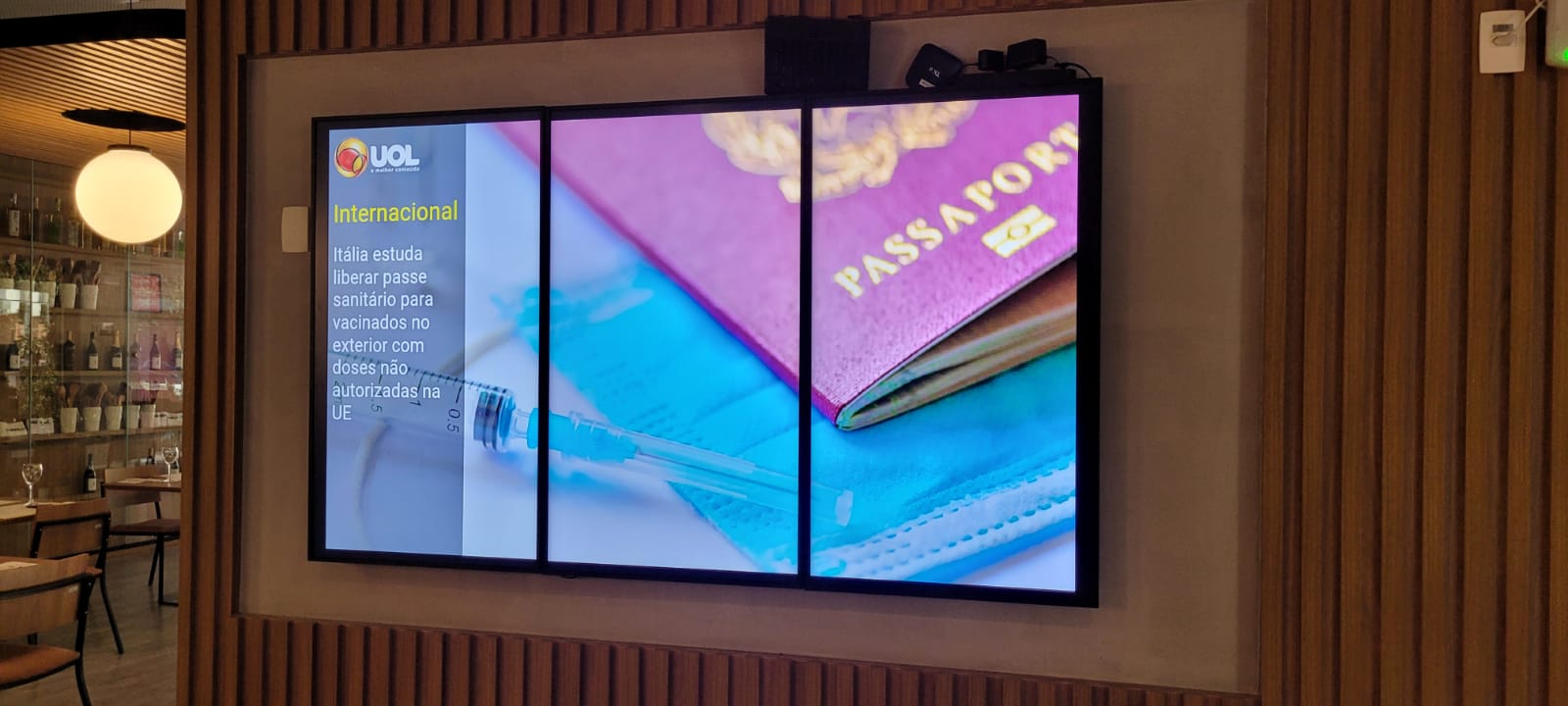 Electronic displays showing flight arrivals at Nuremberg Airport terminal.